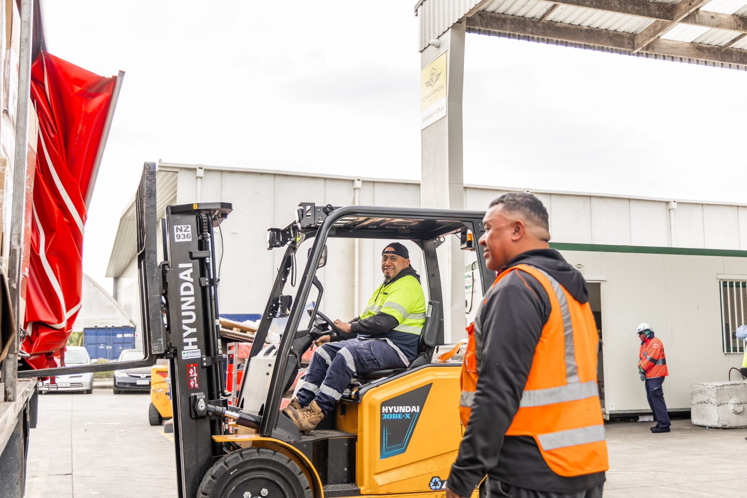 Workers in forklift