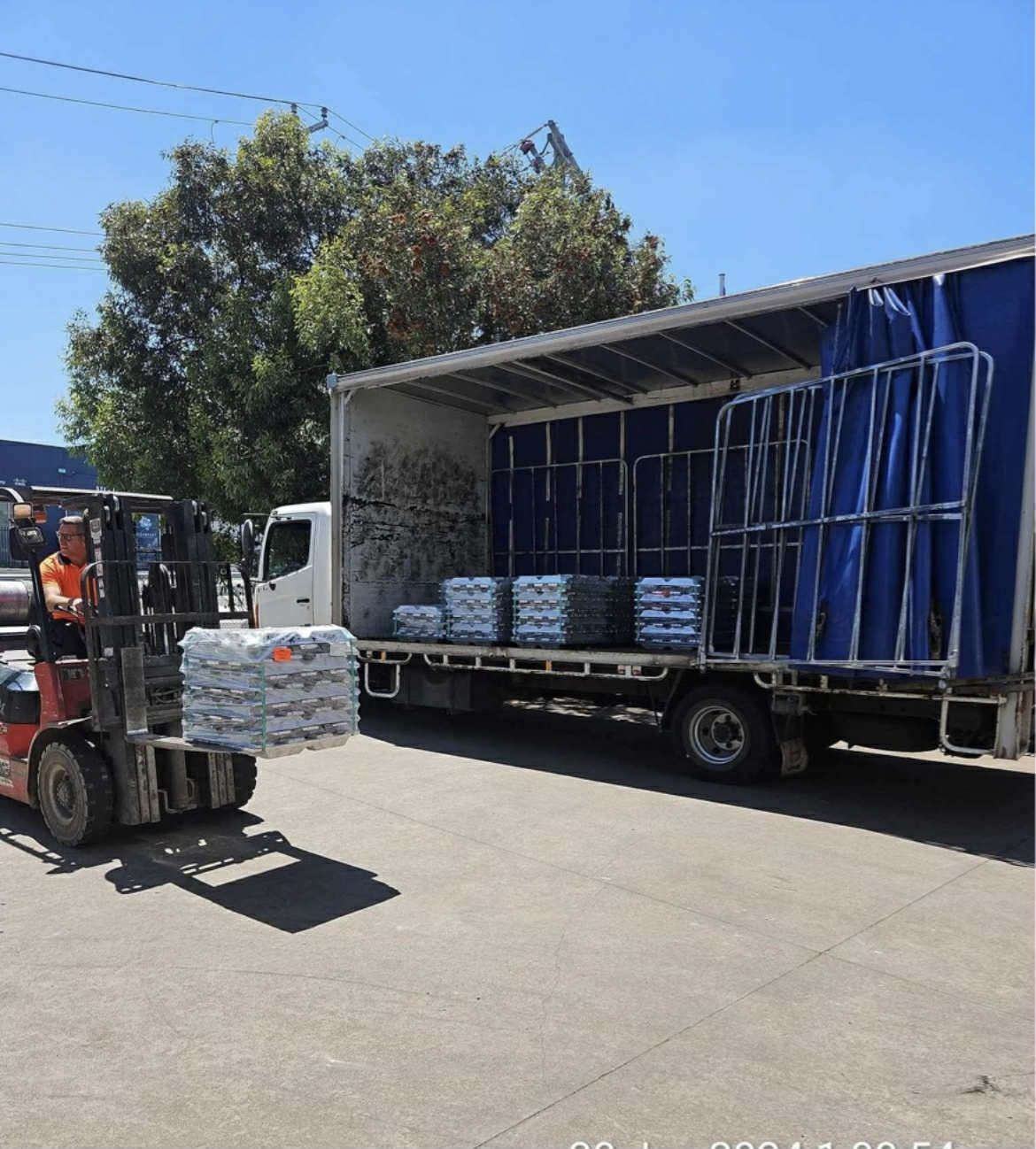Forklift Unloading Packages in truck